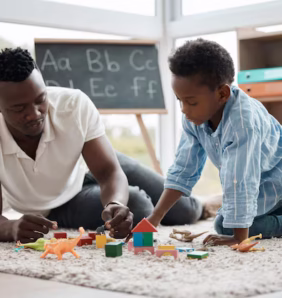 father-child-play-with-toys-together-home