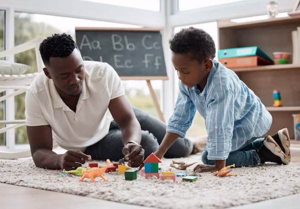 father-child-play-with-toys-together-home